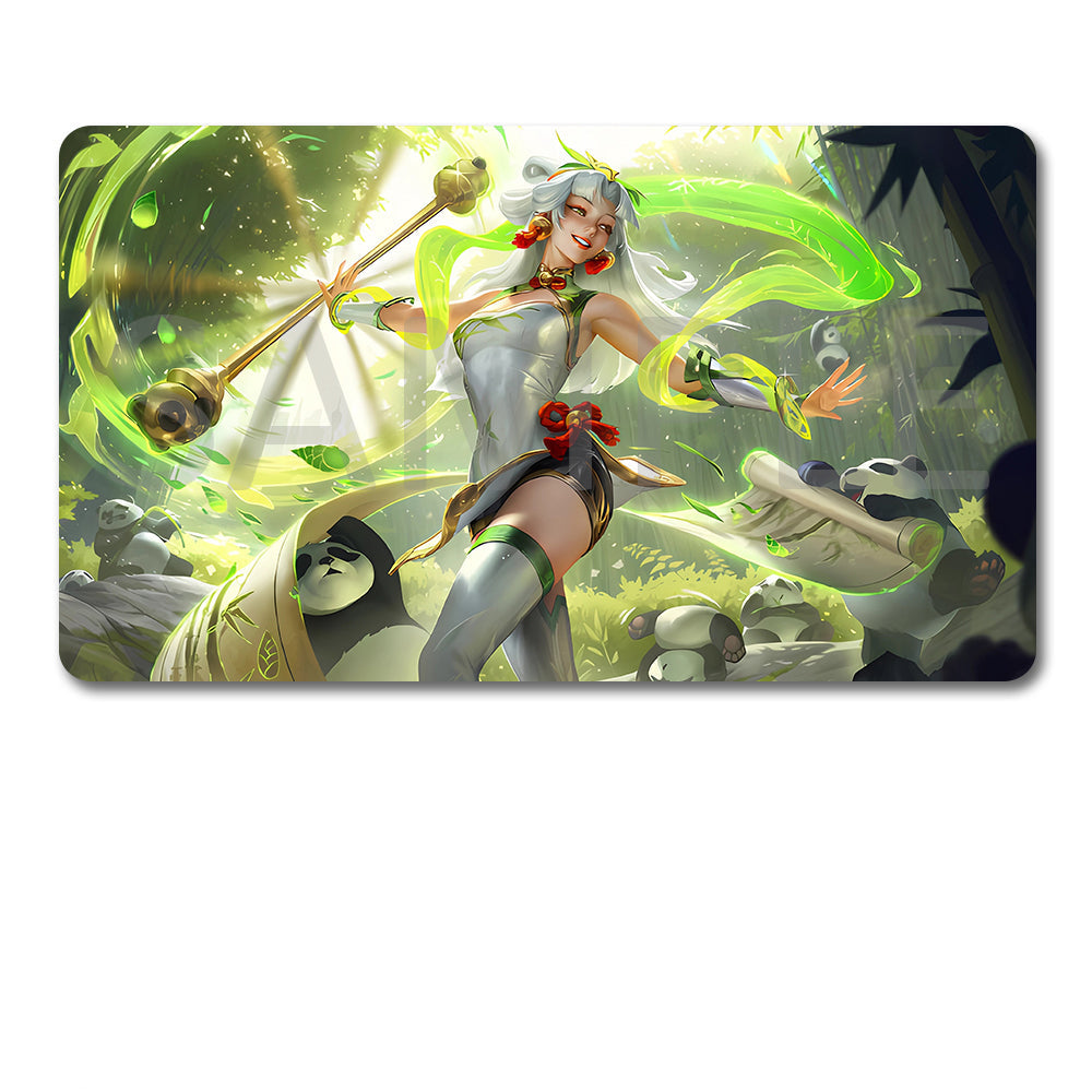 A rectangular gaming mouse pad with rounded corners featuring a colorful fantasy illustration of a female warrior with a mace and green energy effects, shown above a black drawstring storage pouch on a white background.