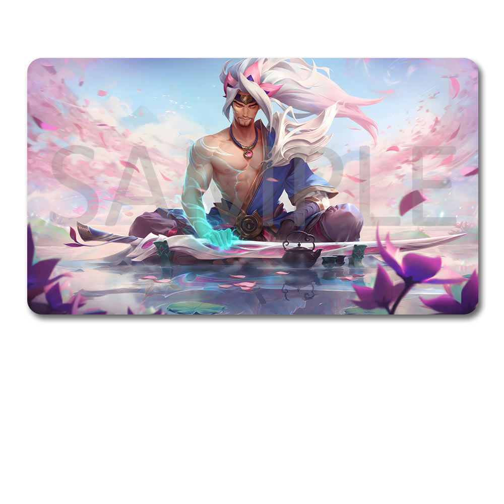 A rectangular gaming mouse pad with rounded corners featuring a colorful fantasy illustration of a white-haired character in a blue robe, shown above a black drawstring storage pouch on a plain white background.