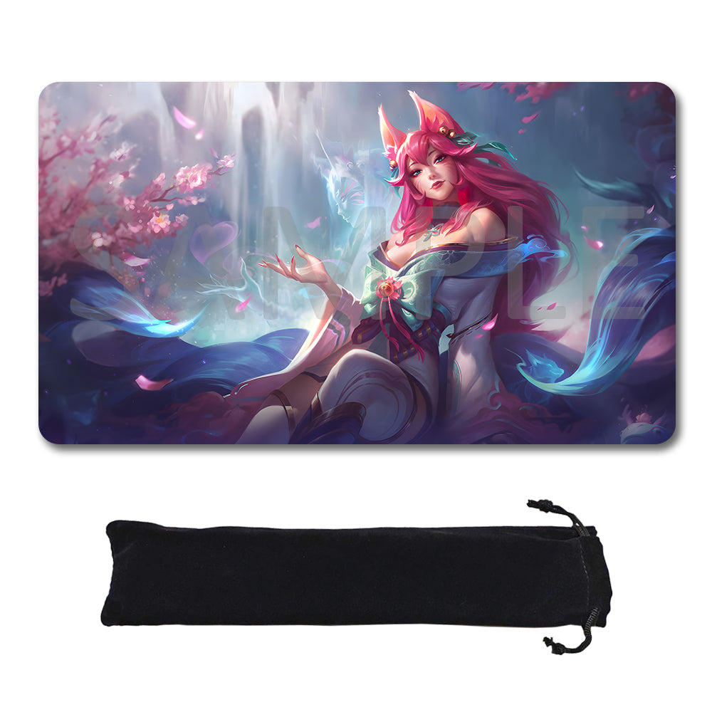 A rectangular gaming mouse pad with rounded corners featuring a colorful fantasy illustration of a fox-like female character with pink hair and glowing blue effects, shown above a black drawstring storage pouch on a white background.