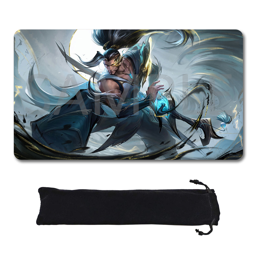 A rectangular gaming mouse pad with rounded corners featuring a fantasy illustration of a warrior character in blue and gray tones, shown above a black drawstring storage pouch on a white background.