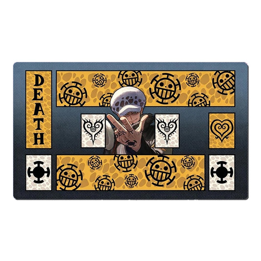 A rectangular anime-themed mat featuring One Piece character designs and the word 'DEATH' on a black background with yellow patterned sections.