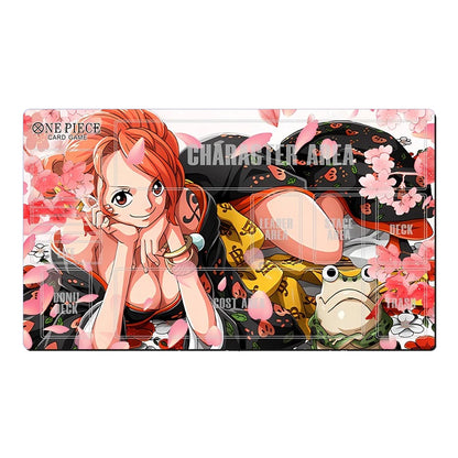 A One Piece trading card game character area mat featuring Nami from the anime, with pink cherry blossoms, a frog, and character-themed text on a white background.