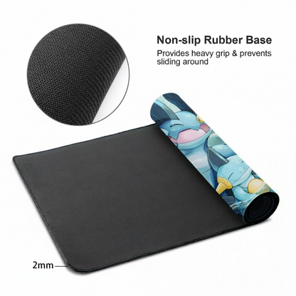 A black gaming mouse pad with a rolled-up section showing a blue and yellow Pokémon design, on a white background with text and an inset showing the non-slip rubber base texture.