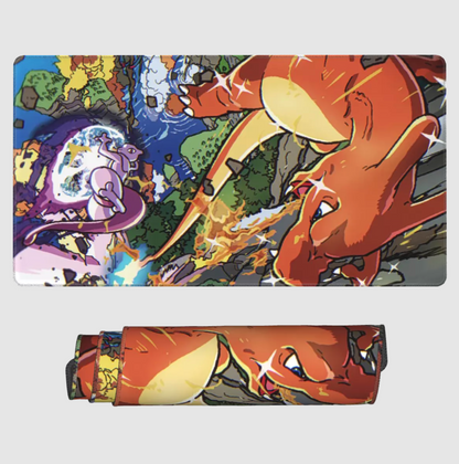 A rectangular printed mat or towel shown flat on a light gray background, with a matching rolled version below. The print features an illustrated battle scene with a large orange dragon-like creature and other fantasy characters in vivid colors.