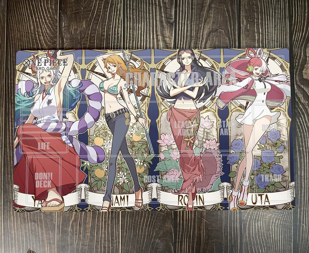 A rectangular printed mat or board featuring anime artwork from One Piece, with four illustrated characters across the surface, photographed on a dark wood plank background.