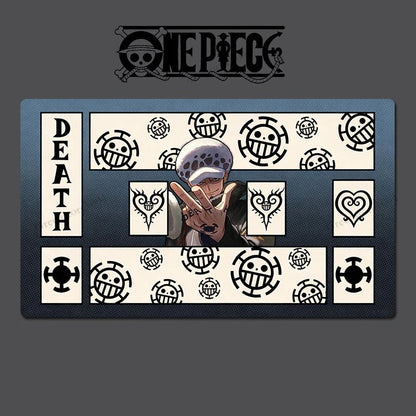A One Piece themed rectangular mat or plaque featuring the character Death with a peace sign, surrounded by black and white One Piece skull-and-crossbones motifs and the word 'DEATH' on the left. The One Piece logo appears above on a dark gray background.