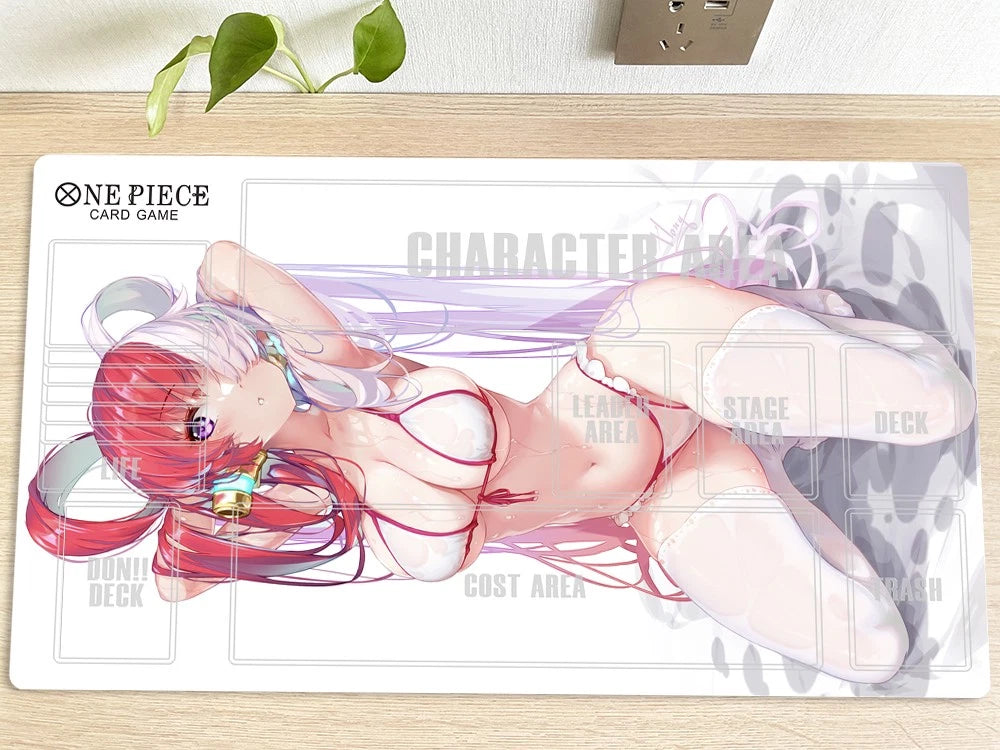 Anime character card on a game mat with 'One Piece' branding