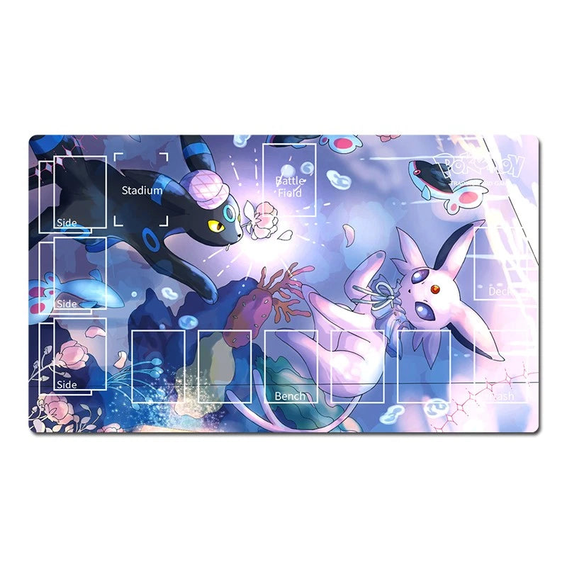 A rectangular gaming playmat featuring an anime-style illustration of Eevee and other Pokémon in a glowing blue and purple underwater scene, with white grid lines and labels for game zones.