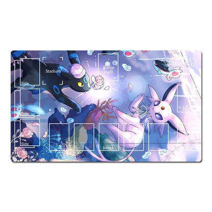 A rectangular gaming playmat featuring an anime-style illustration of Eevee and other Pokémon in a glowing blue and purple underwater scene, with white grid lines and labels for game zones.