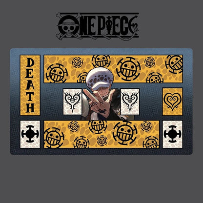 A rectangular One Piece themed mat or plaque featuring the character Death with a peace sign, surrounded by the One Piece logo pattern in yellow and black, on a dark gray background.