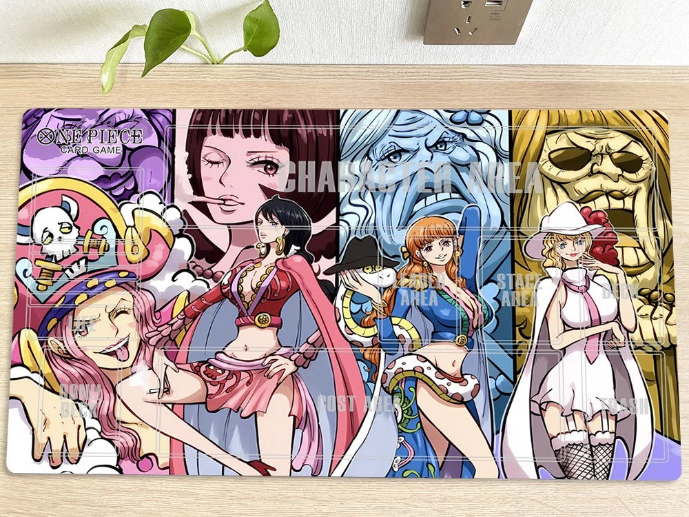 A rectangular anime desk mat featuring characters from One Piece: Pirate Square, laid flat on a light wood surface with a small green plant in the background. The mat has a colorful printed design with multiple character panels and a semi-transparent watermark reading 'CHARASAKU WAVE'.