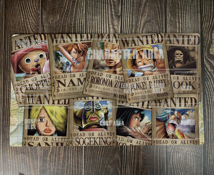 Wanted posters with animated characters on a wooden surface