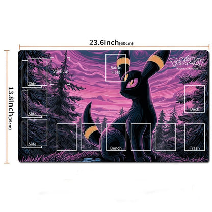 A rectangular Pokémon playmat with a purple and pink forest scene featuring a black character with gold accents, overlaid with white labeled boxes for game areas and dimensions showing 23.6 inches by 13.