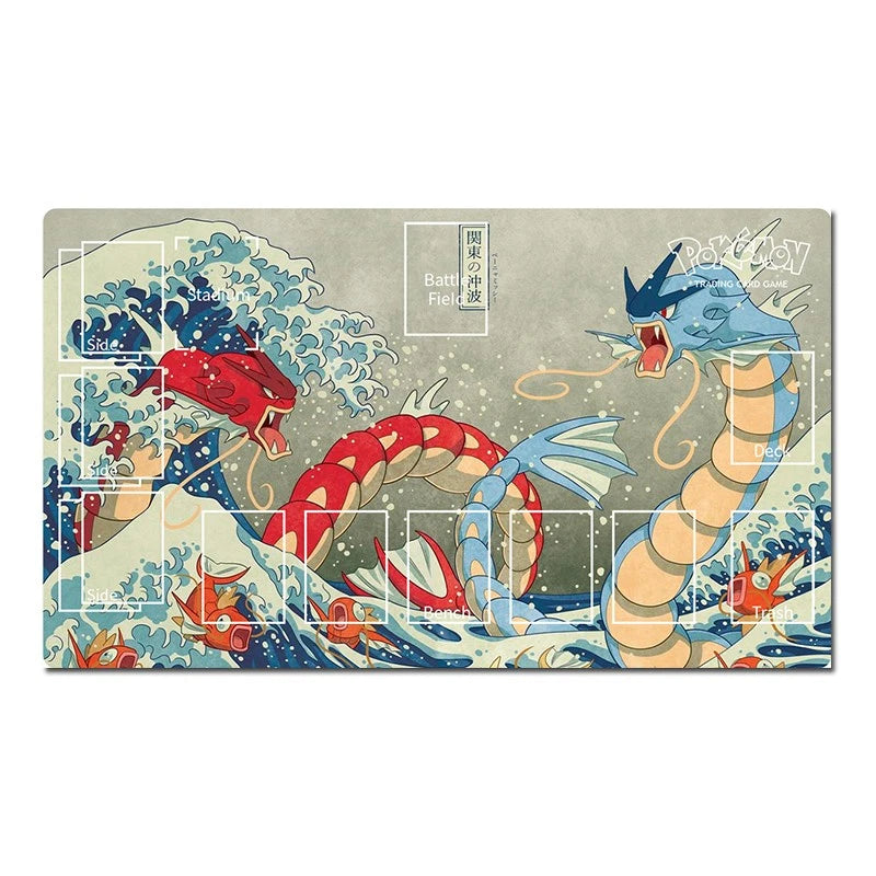 A rectangular art print featuring a stylized Japanese wave scene with two serpentine creatures, one red and one blue, surrounded by white foam and small orange fish. The print has visible grid-like overlay markings and text boxes, photographed against a plain white background.