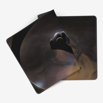 Two square mouse pads with rounded corners, featuring a dark sci-fi graphic of a fist reaching out against a smoky space background, displayed on a clean white background.