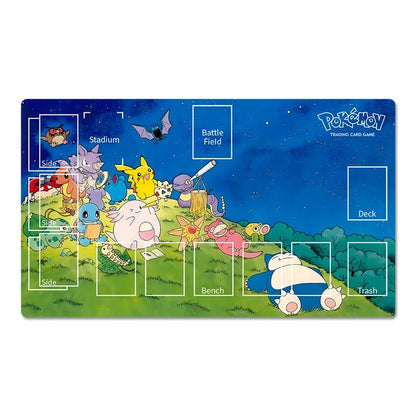 Pokémon trading card game playmat featuring a colorful night scene with various Pokémon characters on a grassy hill under a starry blue sky. The playmat includes labeled sections for Stadium, Battle Field, Deck, Bench, Trash, and Side, with the Pokémon Trading Card Game logo in the top right corner.