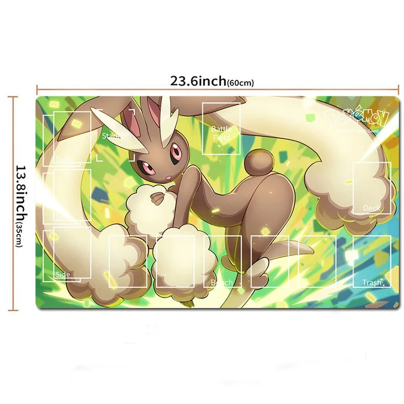 A rectangular Pokémon playmat featuring a brown and cream rabbit-like character on a bright green and yellow background, with printed card slots and dimension labels showing 23.6 inches by 13.