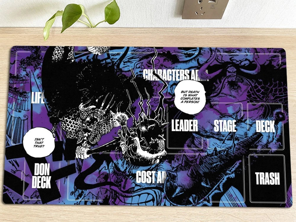 Colorful card game mat with game elements on a wooden surface