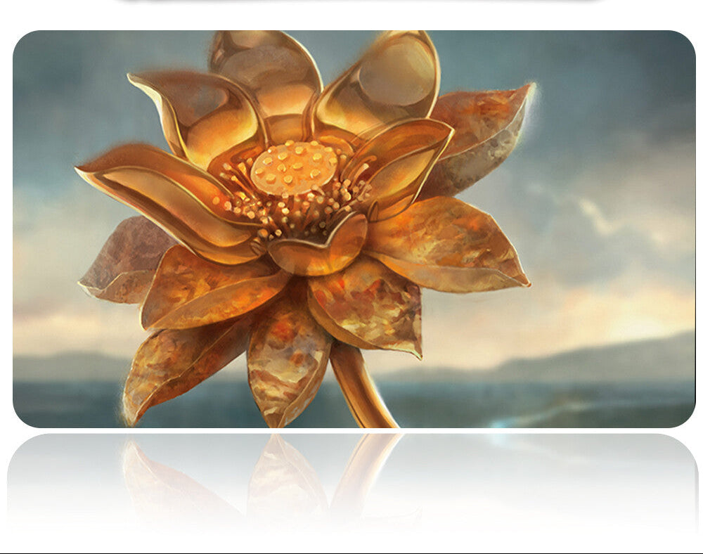 Decorative metal flower with a metallic sheen on a reflective surface