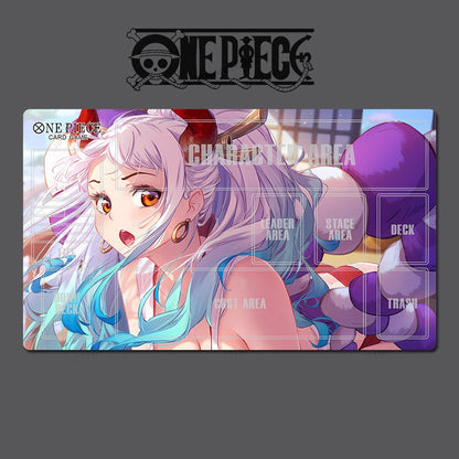 One Piece card game playmat with character artwork on a gray background
