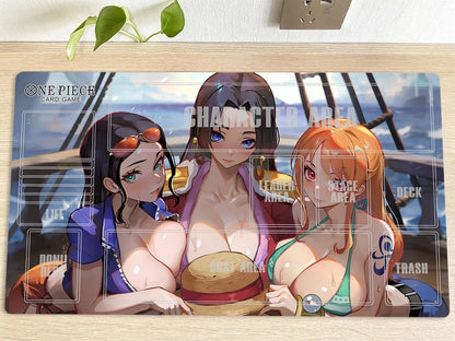 Anime-style character card game mat with three characters on a wooden surface.