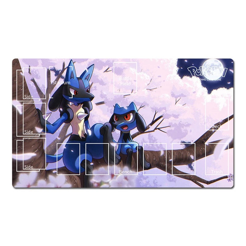 A rectangular Pokémon playmat featuring an illustrated winter scene with two blue-and-black canine characters perched on branches under a pale moonlit sky. White game-layout labels and boxes are printed on the surface, and the Pokémon logo appears in the top-right corner.