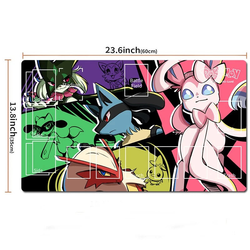 A rectangular Pokémon battle mat with a colorful printed design featuring multiple Pokémon characters, shown on a white background with dimension markings of 23.6 inches by 13.