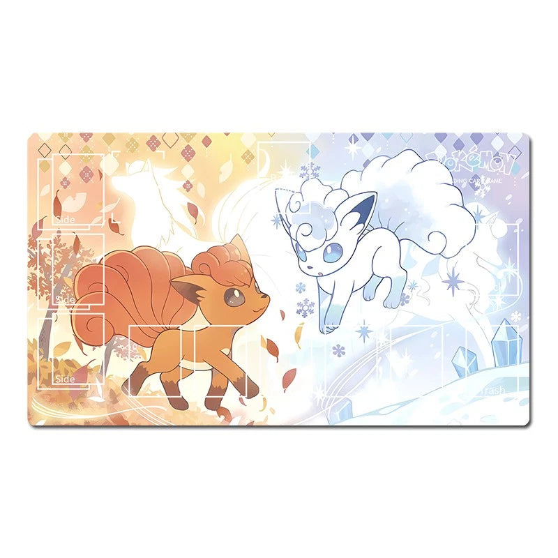 A rectangular gaming playmat featuring a split design with an orange fox-like Pokémon on a warm autumn-themed background on the left, and a white fox-like Pokémon on a cool winter-themed background on the right.