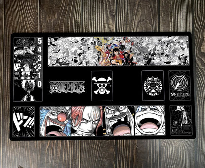 One Piece-themed mouse pad with character illustrations on a wooden surface