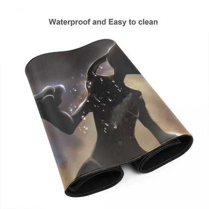 A rolled-up black neoprene desk mat featuring a glossy, reflective graphic design of a woman's silhouette with water droplets, shown on a white background with the text 'Waterproof and Easy to clean' at the top.