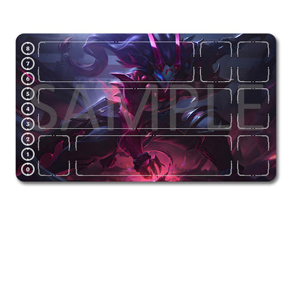 A rectangular gaming playmat with a dark fantasy character illustration and white slot outlines, shown above a black drawstring storage pouch on a plain white background.