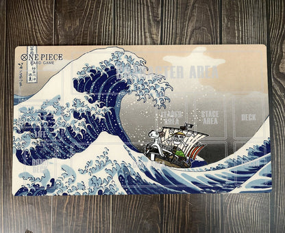 Placemat with 'One Piece' design featuring a ship in a wave on a wooden surface