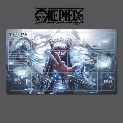 One Piece card game playmat with character artwork on a dark background