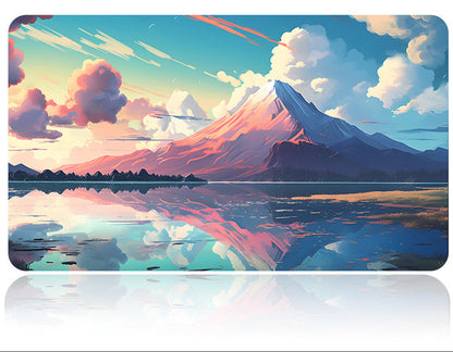 Mouse pad with mountain and lake design and a pen on a white background