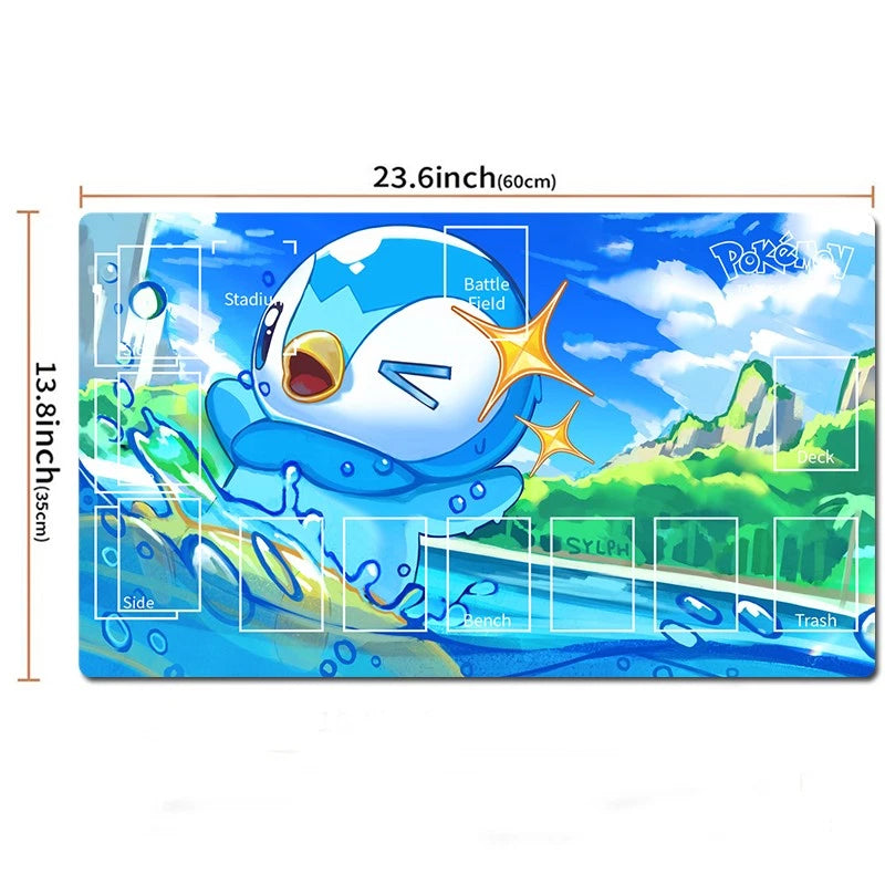 A rectangular Pokémon-themed playmat or desk mat featuring Piplup in a blue water scene with green hills and a bright sky. White printed area markers and dimension lines show the mat is 23.