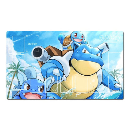 A rectangular gaming mat featuring a colorful illustration of Pokémon Bulbasaur and Squirtle under a blue sky with clouds, printed with white play area markings and labels.