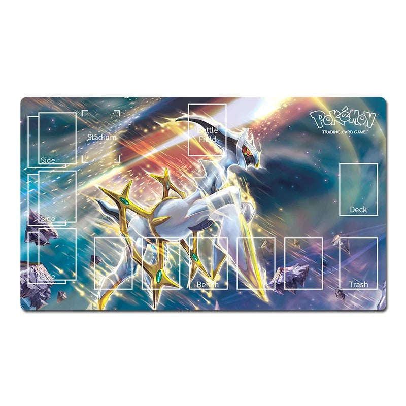 A rectangular Pokémon trading card playmat featuring a dynamic illustration of a white and gold Pokémon in a cosmic space scene with blue, purple, and orange light effects. The playmat includes printed white areas labeled for Slide, Battle, Deck, Trash, and Stadium, along with small illustrated card slots around the edges.