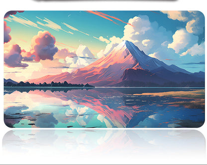 Mouse pad with mountain and lake design and a pen on a white background